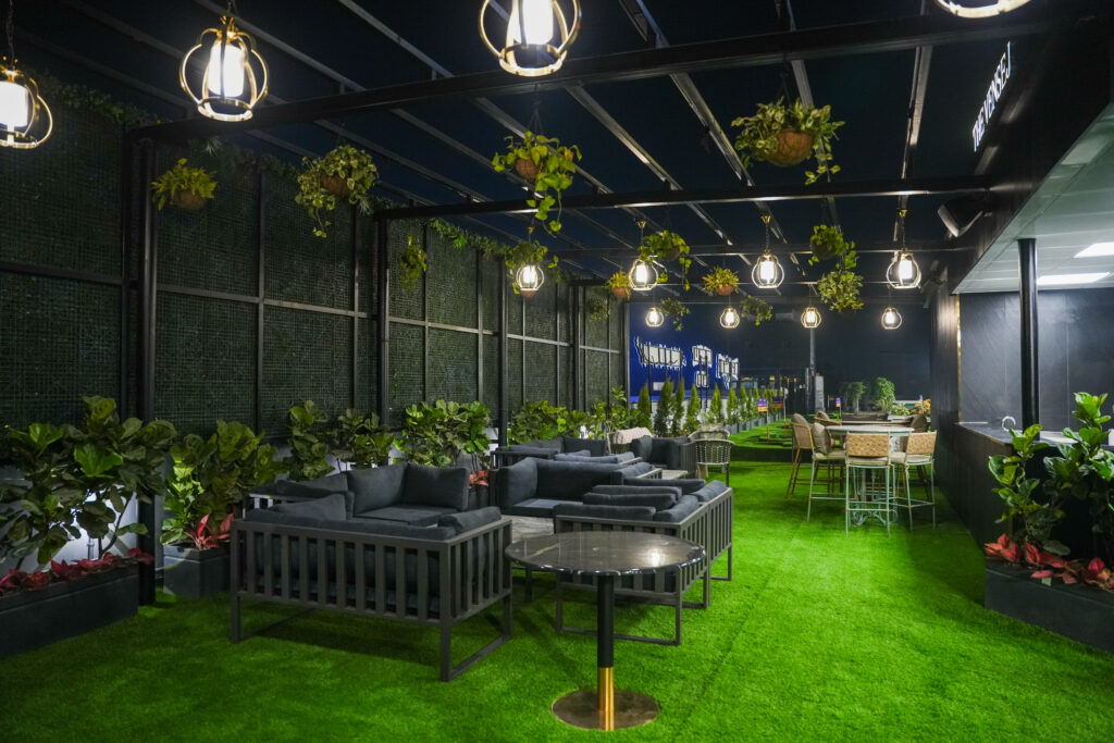Kids birthday party in Gurgaon at Rumble Zone rooftop lounge with seating, greenery, and ambient lighting