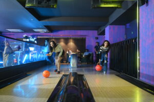 Gaming zone in Gurgaon with friends enjoying bowling at Rumble Zone indoor entertainment center