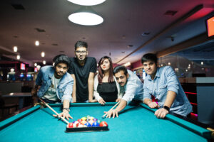 Pool table in Gurgaon with friends playing at Rumble Zone, one of the best gaming zone in Gurgaon