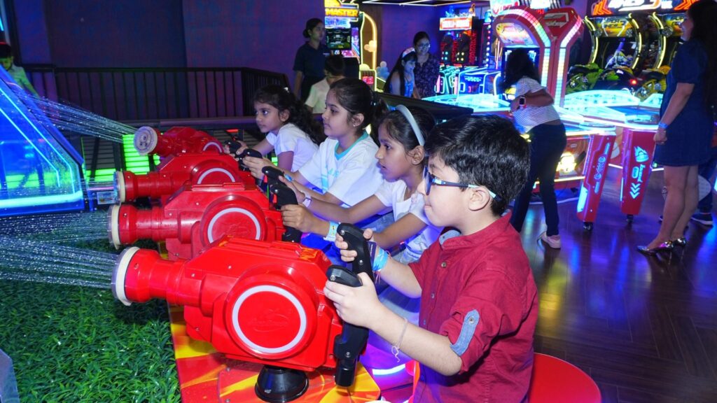 kids enjoying arcade games at a gaming arcade in gurgaon at rumble zone